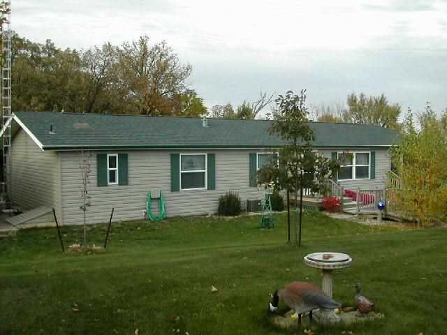 9209 West Wire Road Winslow, IL 61089 - Photo 2 of 9 a view of a house with a yard and sitting area