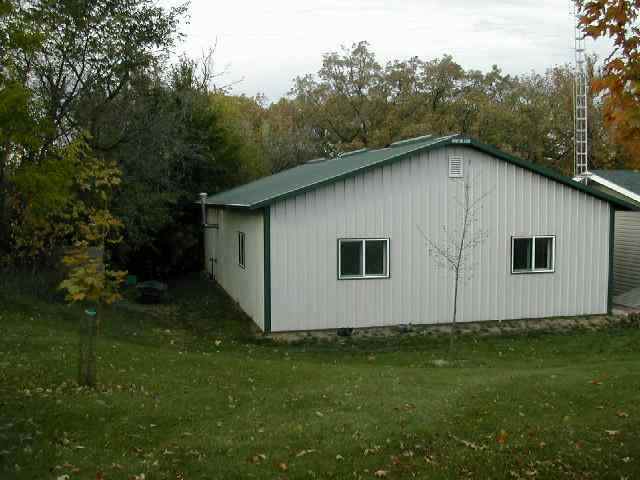 9209 West Wire Road Winslow, IL 61089 - Photo 4 of 9 a house with trees in the background