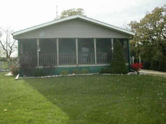 9209 West Wire Road Winslow, IL 61089 - Photo 6 of 9 front view of a house and a yard