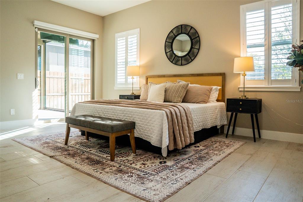 2514 Shannon Road Orlando, FL 32806 - Photo 24 of 53 a bedroom with a bed and a table next to a window