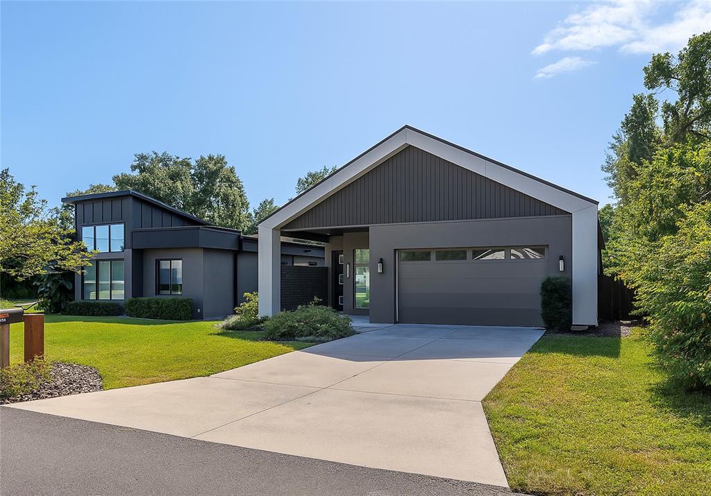 2514 Shannon Road Orlando, FL 32806 - Photo 3 of 53 a front view of a house with a yard and garage
