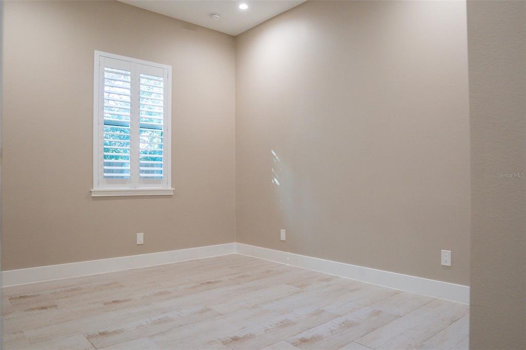 2514 Shannon Road Orlando, FL 32806 - Photo 34 of 53 an empty room with wooden floor and windows