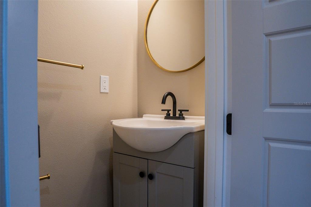 2514 Shannon Road Orlando, FL 32806 - Photo 43 of 53 a bathroom with a sink and a mirror