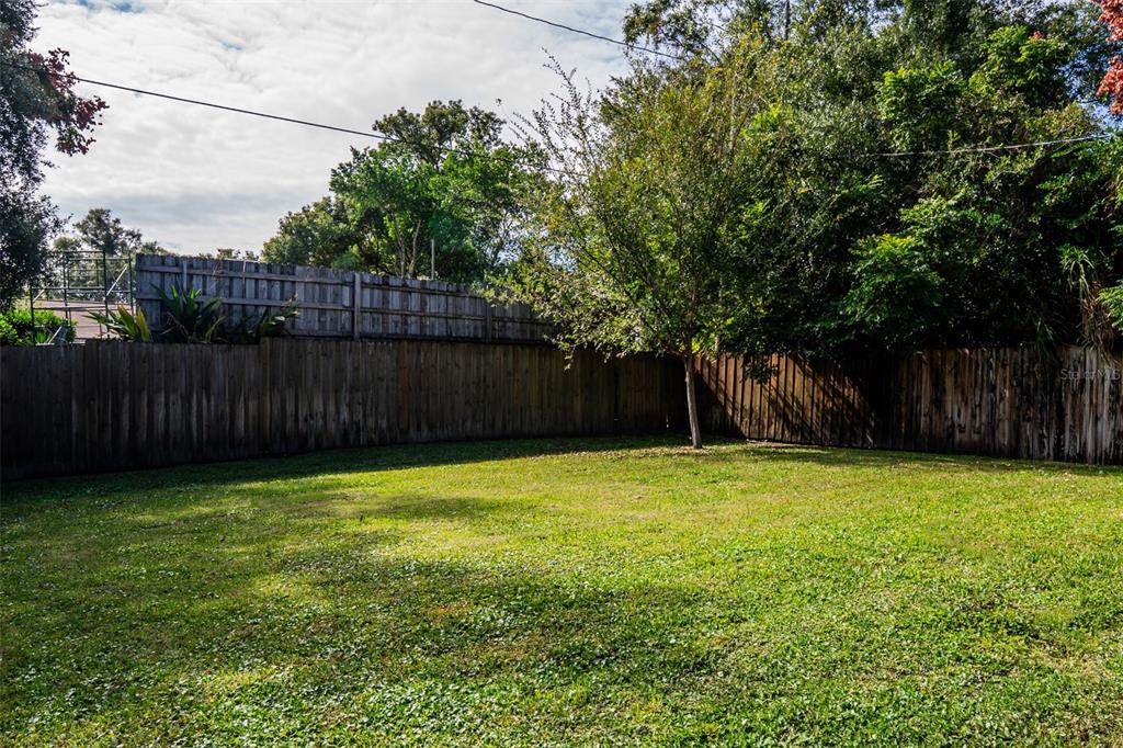 2514 Shannon Road Orlando, FL 32806 - Photo 50 of 53 a view of a backyard with wooden fence