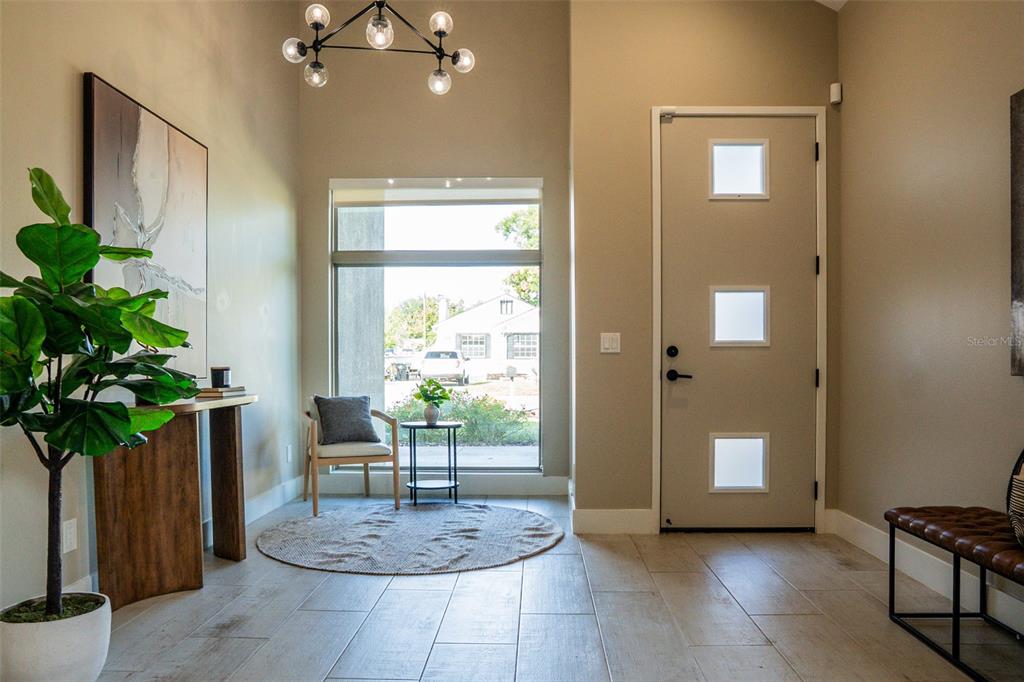 2514 Shannon Road Orlando, FL 32806 - Photo 5 of 53 a view of a hallway with wooden floor and a potted plant
