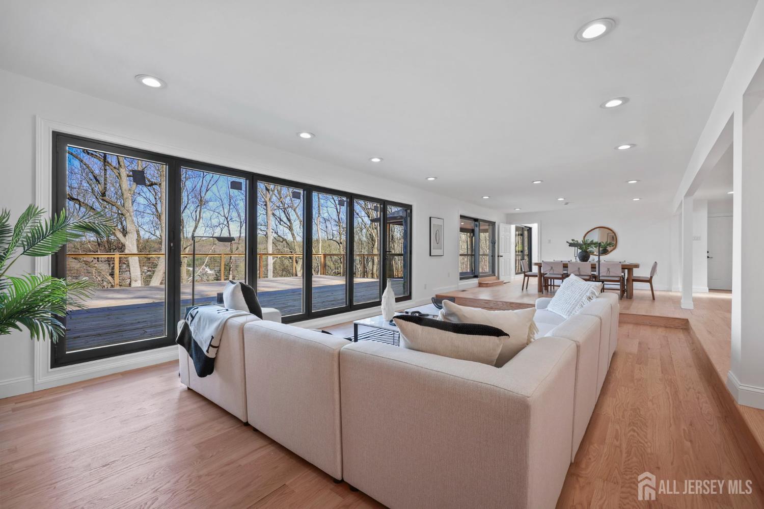 120 Nolan Road Morganville, NJ 07751 - Photo 16 of 85 a living room with furniture and a large window