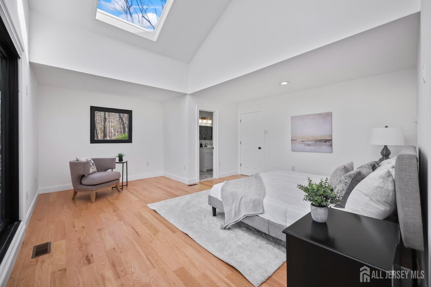 120 Nolan Road Morganville, NJ 07751 - Photo 28 of 85 a bedroom with a bed and a couch