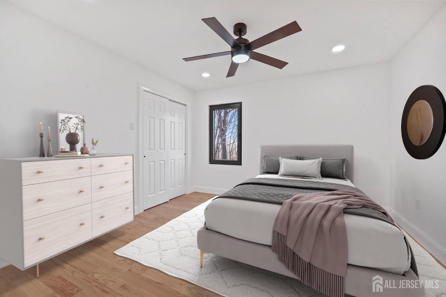 120 Nolan Road Morganville, NJ 07751 - Photo 32 of 85 a bedroom with a large bed and a chandelier