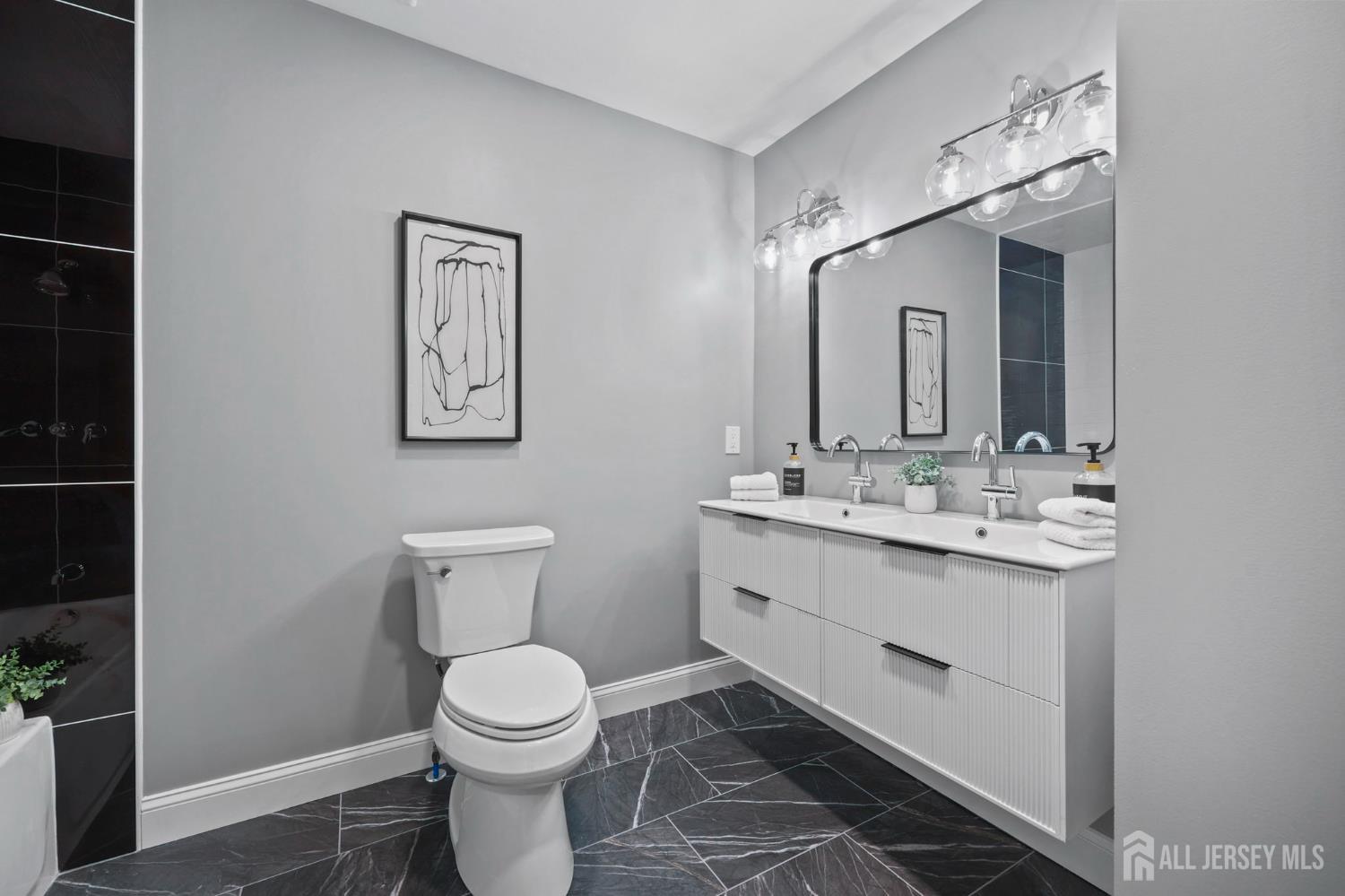 120 Nolan Road Morganville, NJ 07751 - Photo 34 of 85 a bathroom with a toilet sink and mirror