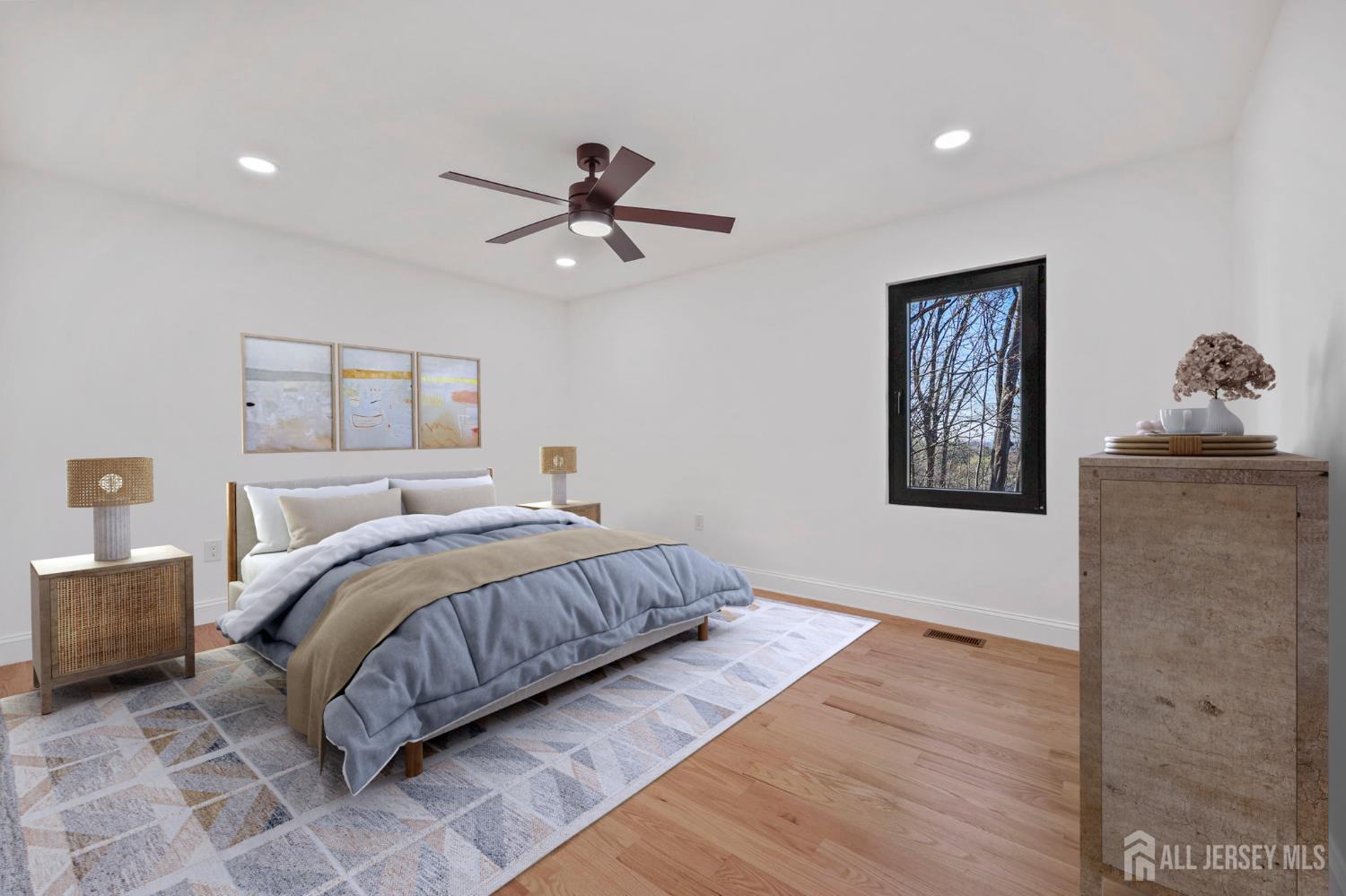 120 Nolan Road Morganville, NJ 07751 - Photo 38 of 85 a bedroom with a large bed and a ceiling fan