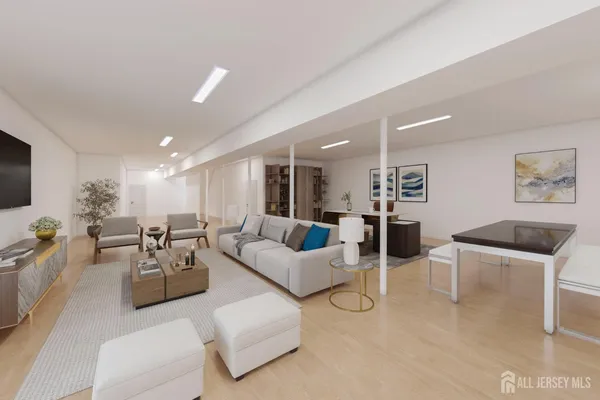 an aerial view of residential houses with city and green space