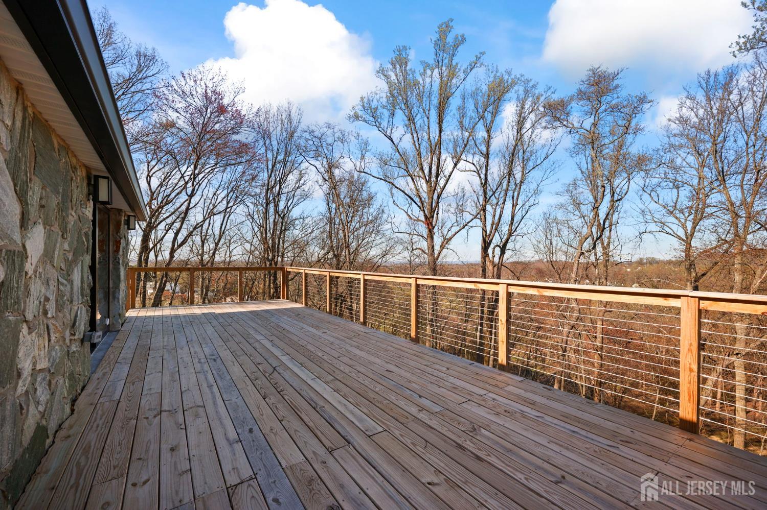 120 Nolan Road Morganville, NJ 07751 - Photo 47 of 85 a view of balcony with wooden floor and fence
