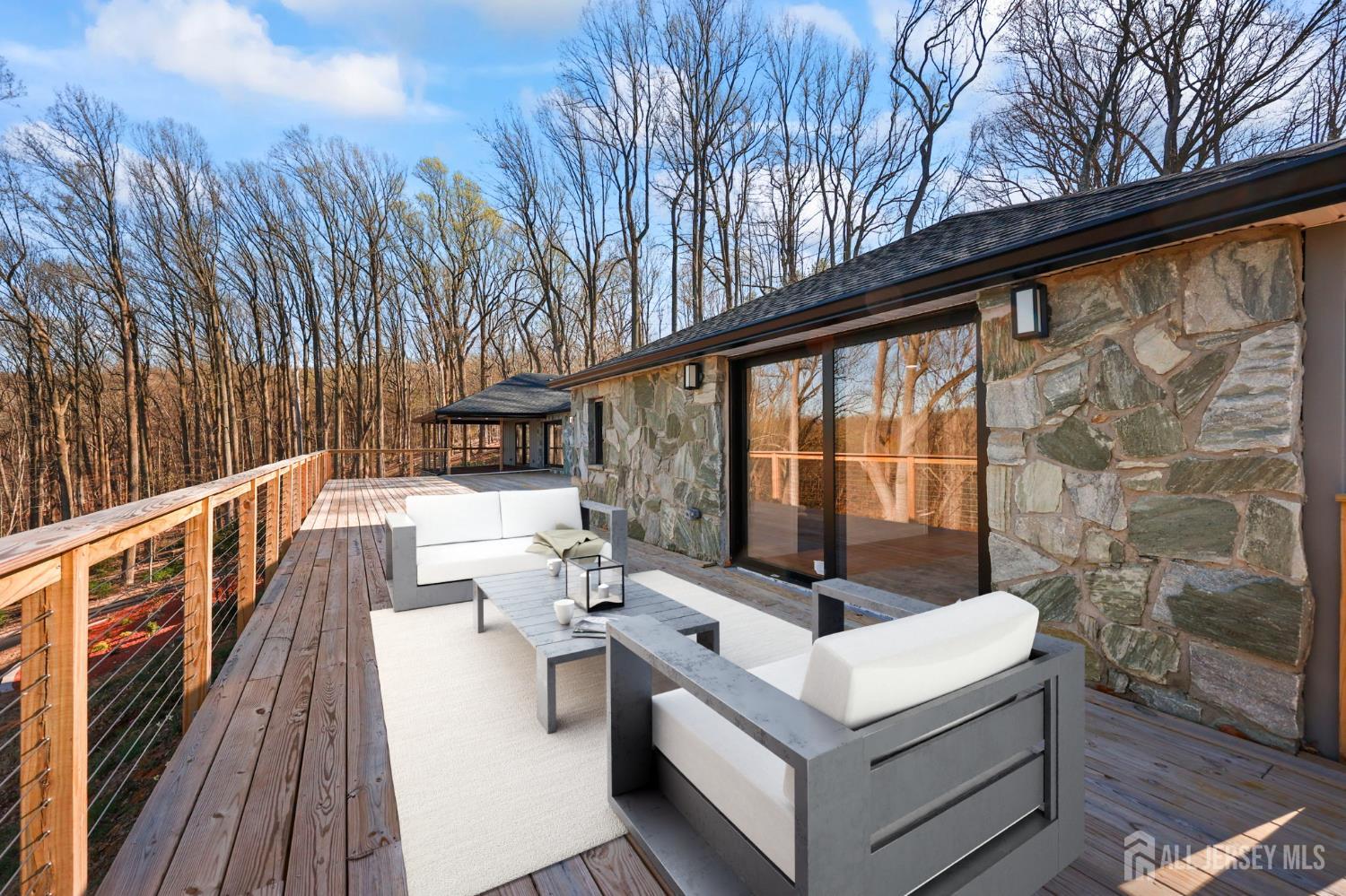 120 Nolan Road Morganville, NJ 07751 - Photo 48 of 85 a view of balcony with couch and wooden floor