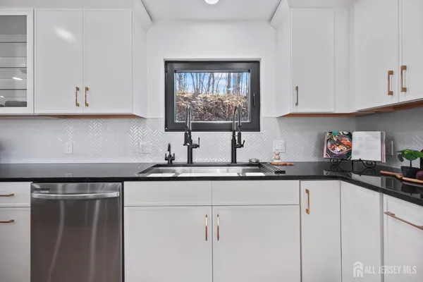 a spacious bedroom with a large bed and a window