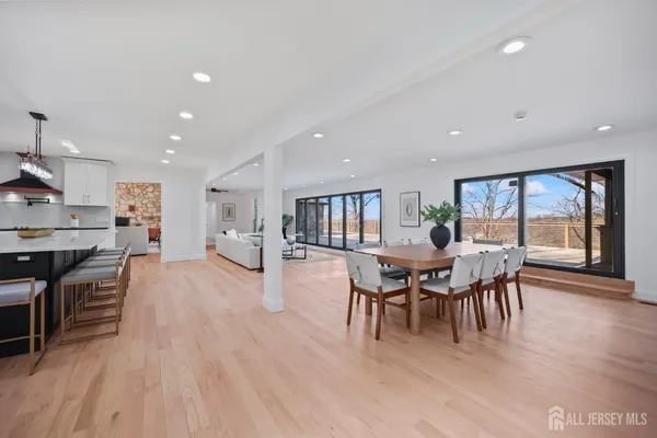 a spacious bedroom with a large bed and a large window