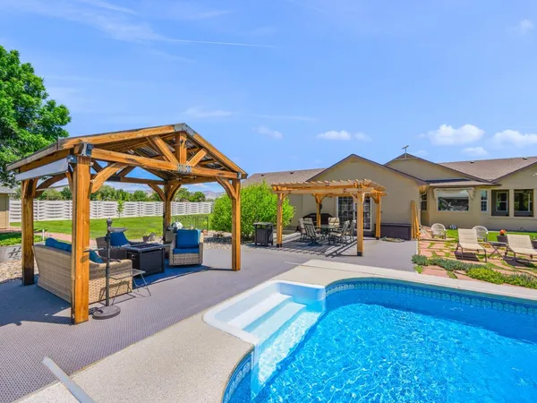 a view of a yard with an outdoor seating