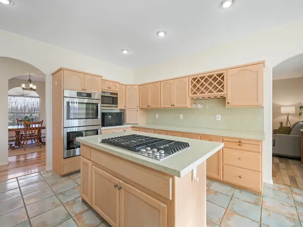 a kitchen with a sink cabinets and stainless steel appliances