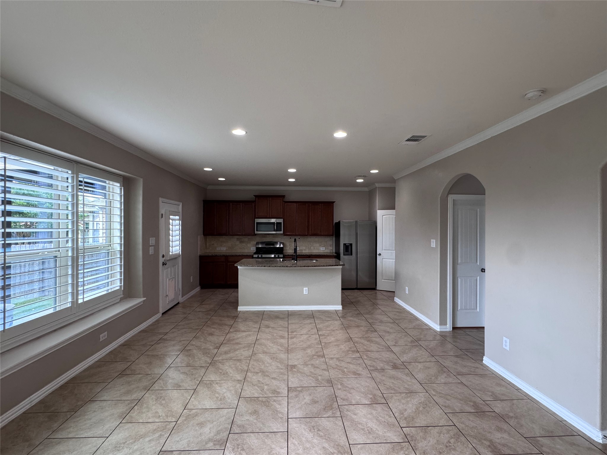 2605 Rough Berry Road Pflugerville, TX 78660 - Photo 40 of 40 A functional open floorplan offers seamless flow from the kitchen to the living area.