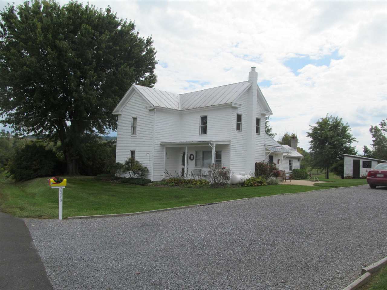 2240 Pepper Road Mount Jackson, VA 22842 - Photo 26 of 33 a view of a white house next to a yard with big trees