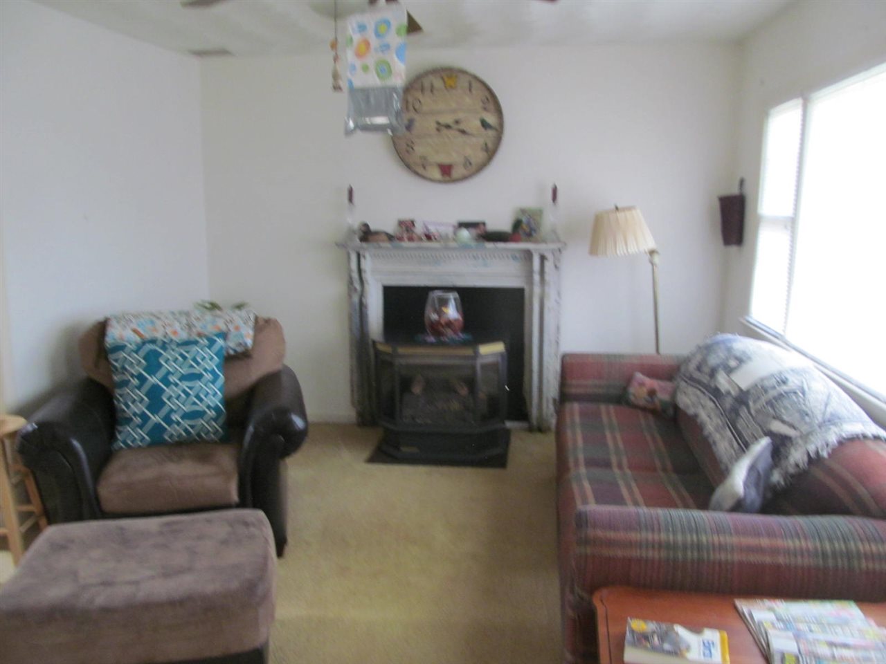 2240 Pepper Road Mount Jackson, VA 22842 - Photo 3 of 33 a living room with furniture a clock and a fireplace