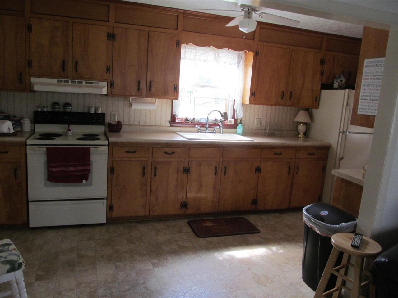 2240 Pepper Road Mount Jackson, VA 22842 - Photo 7 of 33 a kitchen with a stove a refrigerator and a sink