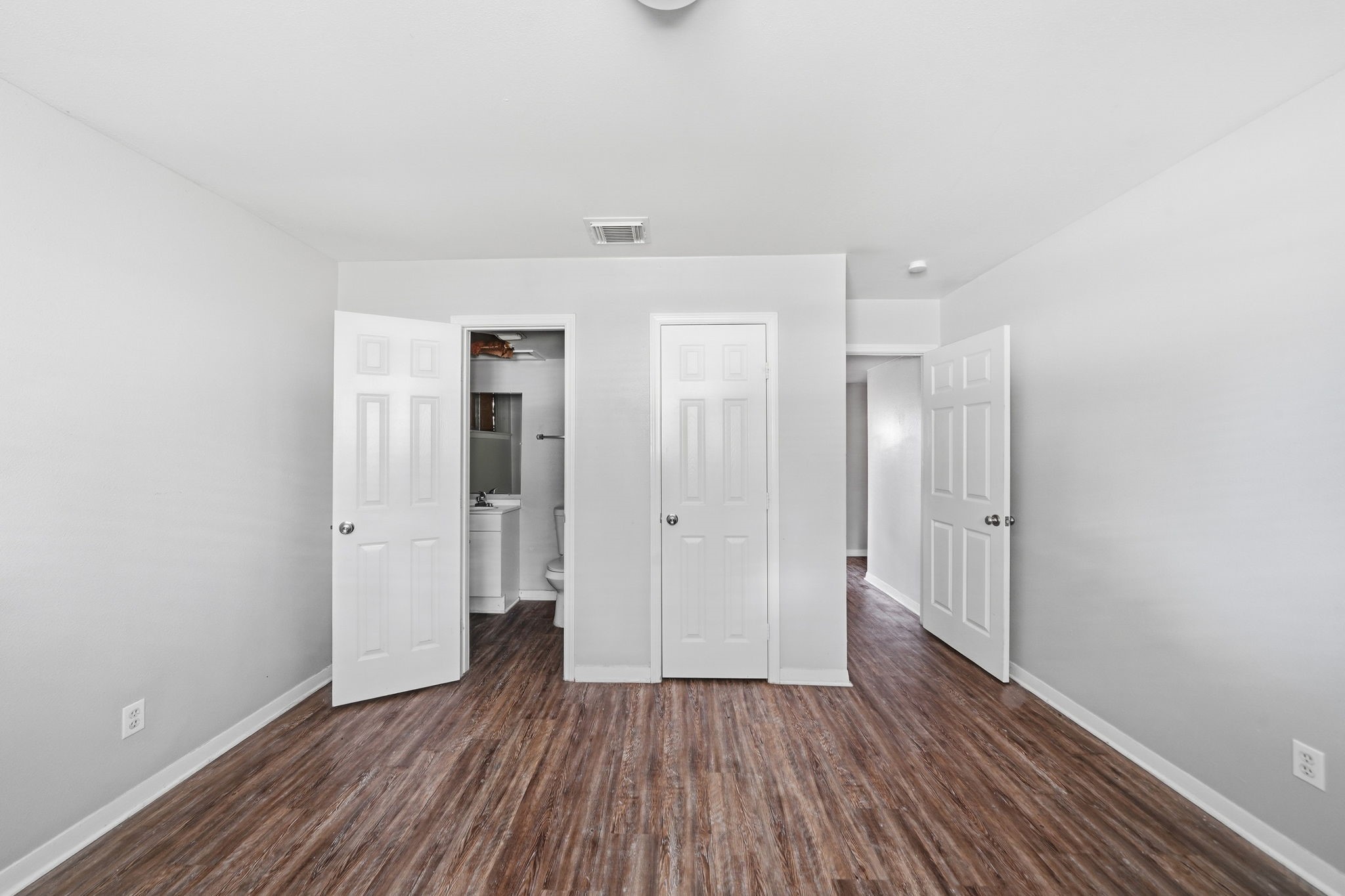 6410 Hopper Road Houston, TX 77016 - Photo 21 of 28 a view of a hallway with wooden floor
