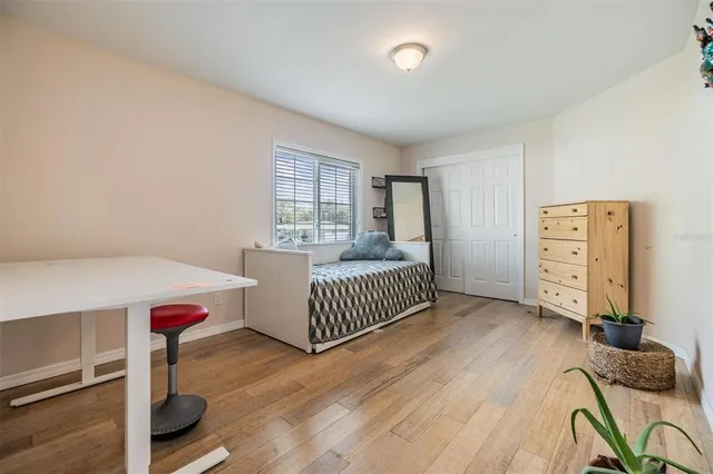 a bedroom with furniture and a window