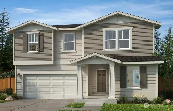 a front view of a house with garage