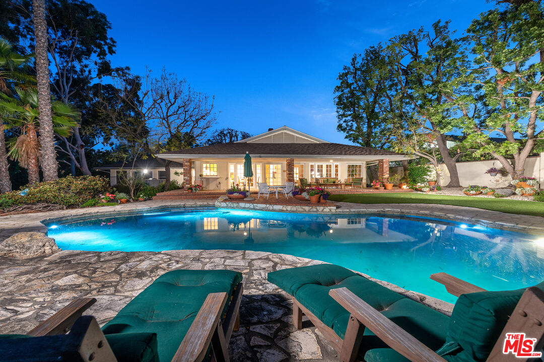 16331 Tudor Drive Encino, CA 91436 - Photo 1 of 71 a view of house with swimming pool yard fire pit and outdoor seating
