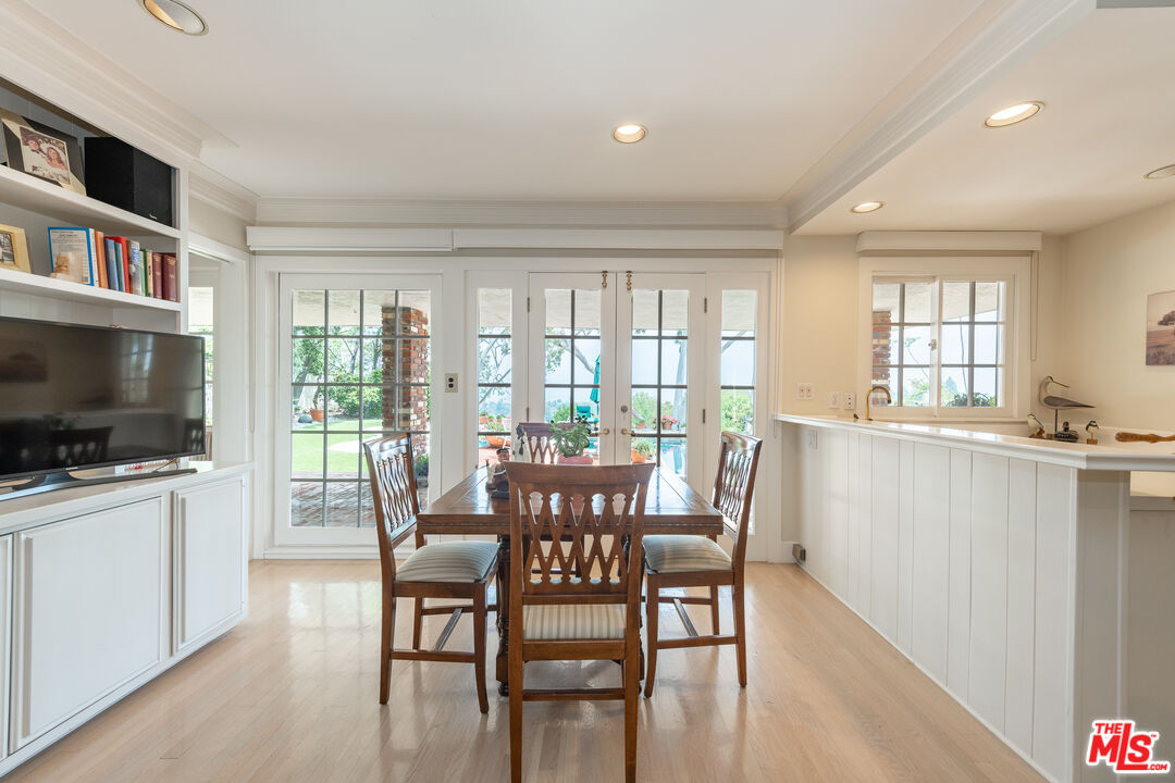 16331 Tudor Drive Encino, CA 91436 - Photo 13 of 71 a view of a dining room with furniture window and wooden floor