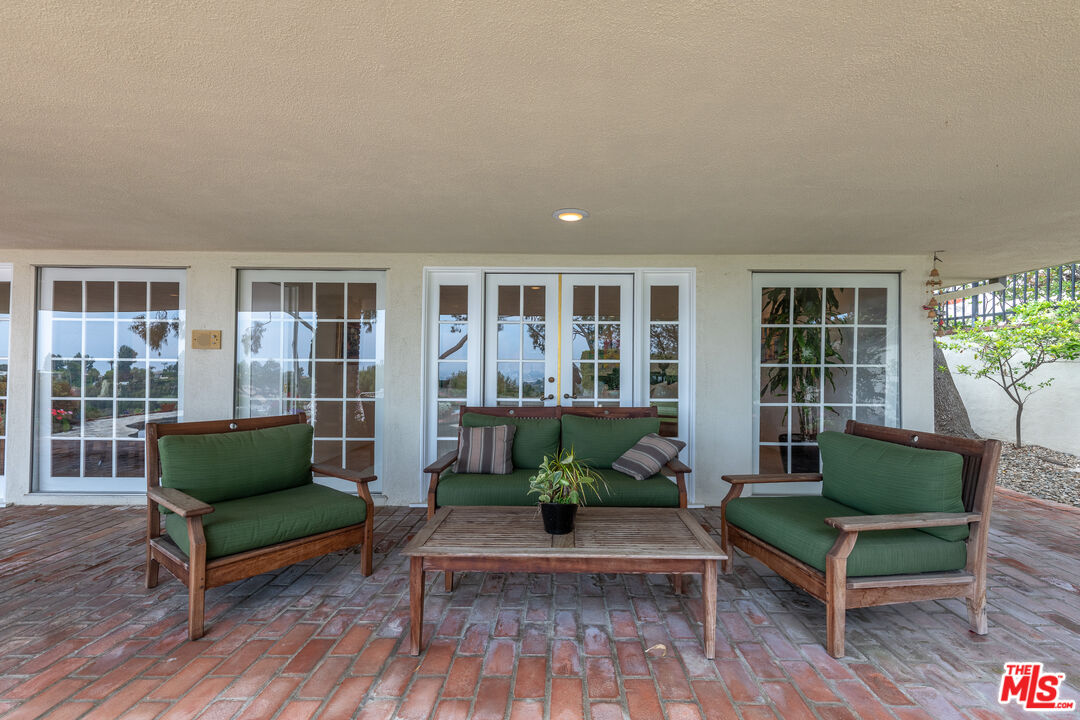 16331 Tudor Drive Encino, CA 91436 - Photo 32 of 71 a living room with furniture and a potted plant
