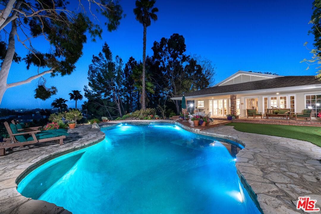 16331 Tudor Drive Encino, CA 91436 - Photo 43 of 71 a view of a house with swimming pool and sitting area