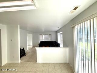 284 Brookfield Drive Jackson, NJ 08527 - Photo 8 of 17 a kitchen with a refrigerator a stove top oven and a large window