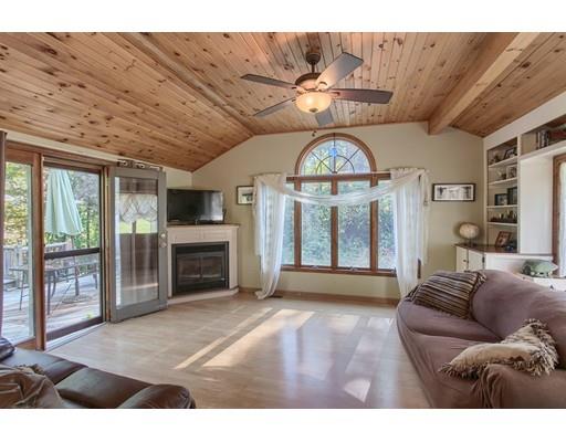 16 Johnson Road Sterling, MA 01564 - Photo 3 of 20 a living room with furniture a chandelier and a fireplace