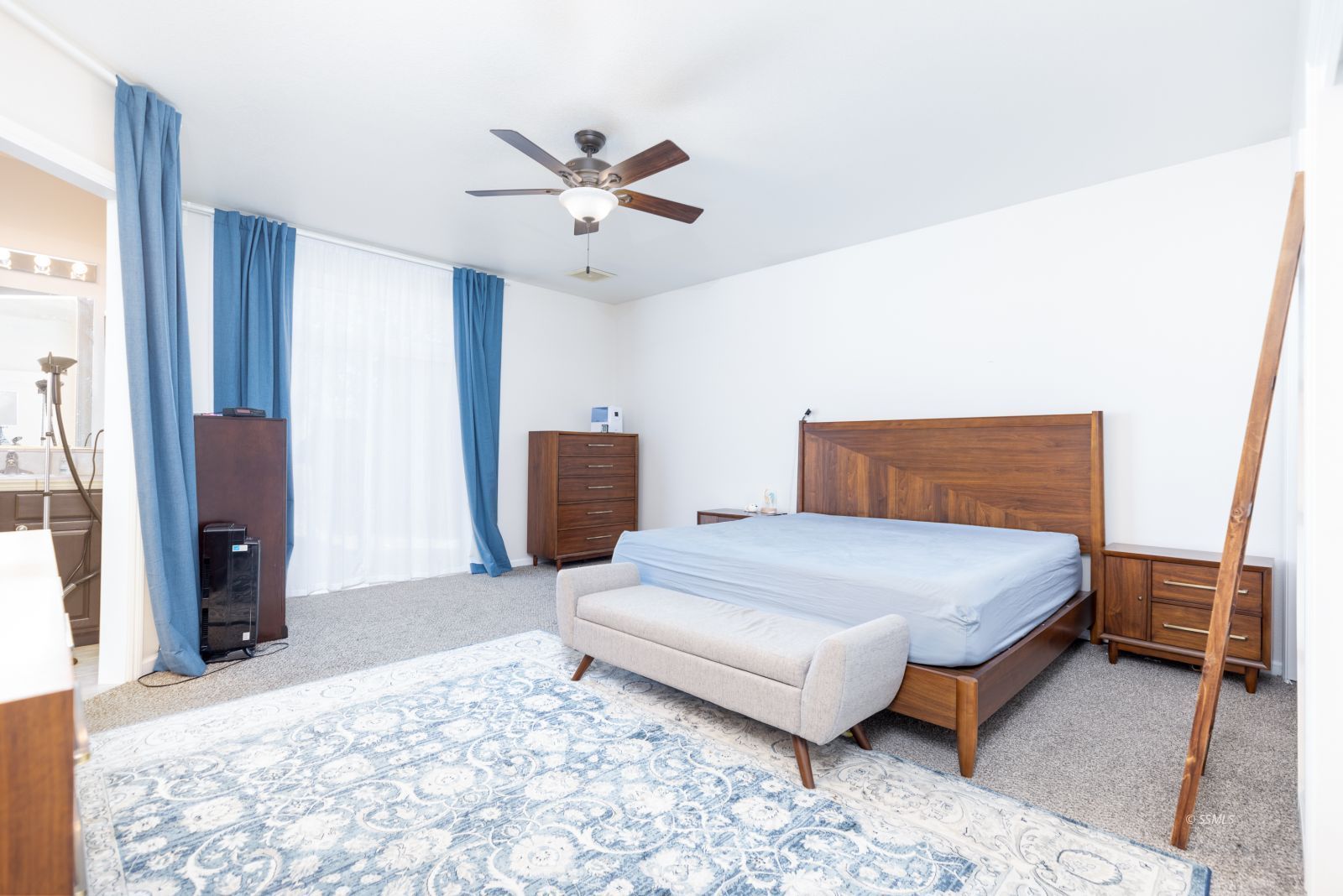 648 Pinon Court Ridgecrest, CA 93555 - Photo 16 of 35 a bedroom with a bed and wooden floor