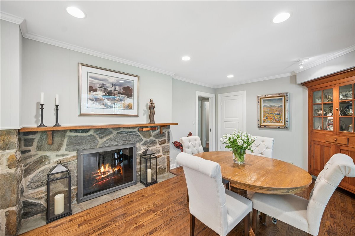 253 Summerfield Road Northbrook, IL 60062 - Photo 18 of 46 a living room with furniture and a fireplace