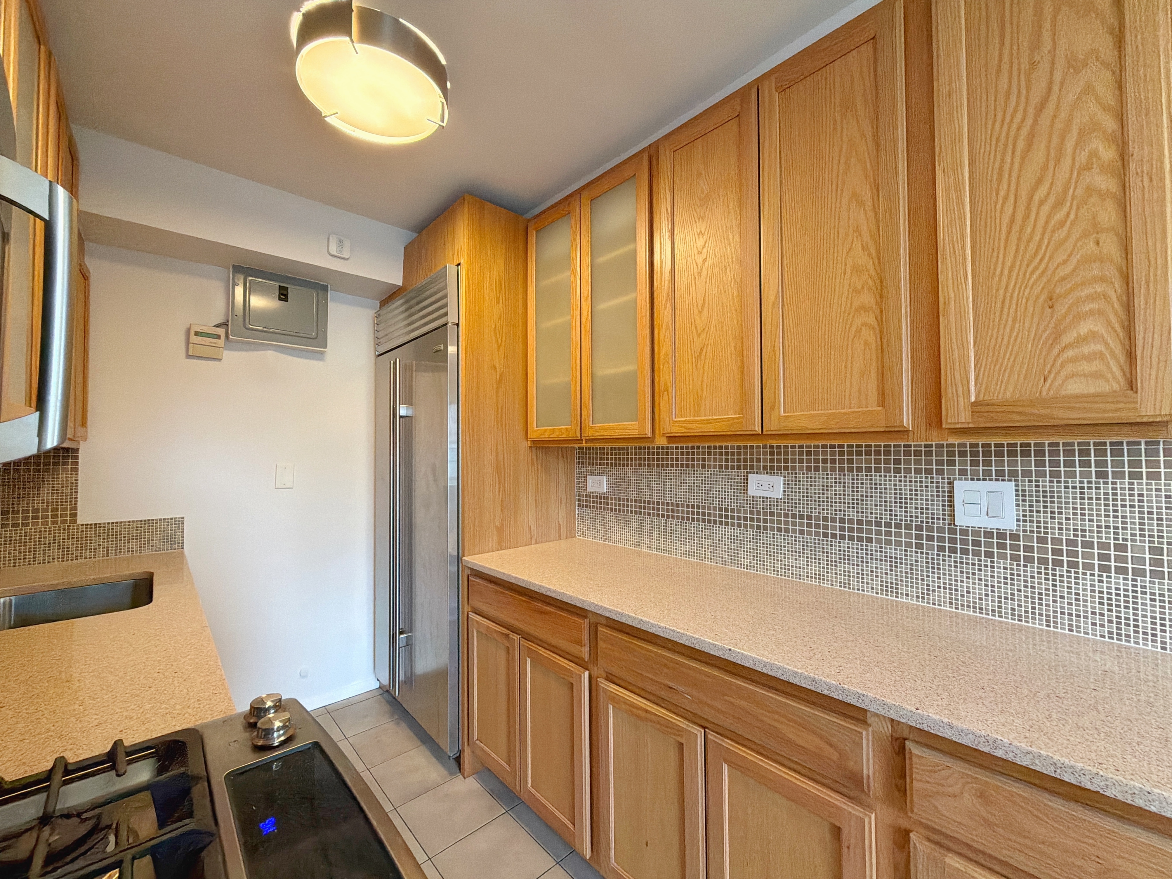 175 Adams Street, Unit 9DE Brooklyn, NY 11201 - Photo 12 of 18 a bathroom with a sink and a mirror
