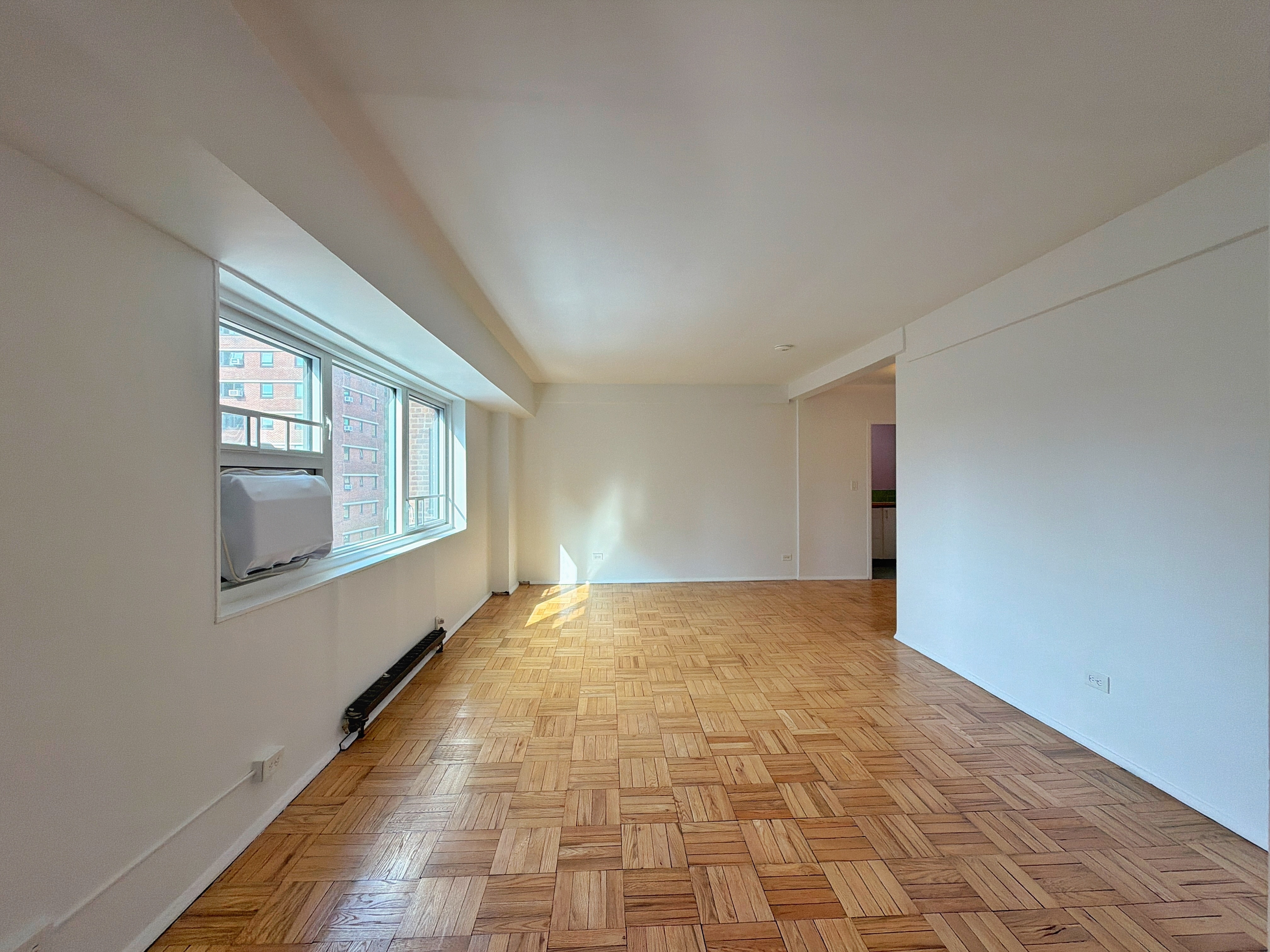 175 Adams Street, Unit 9DE Brooklyn, NY 11201 - Photo 14 of 18 a view of an empty room with a window
