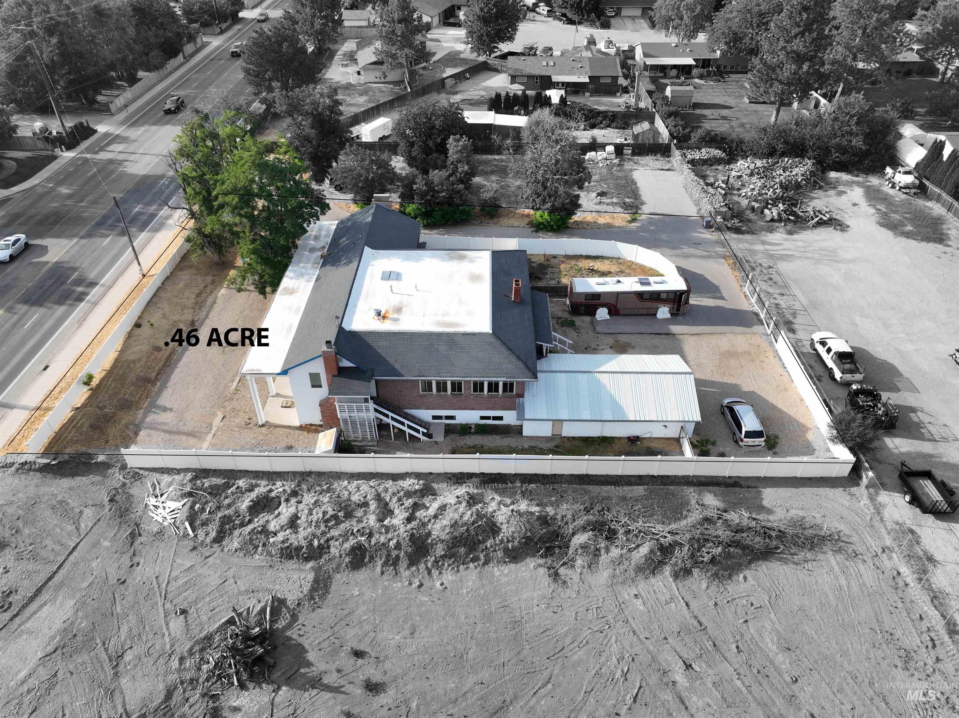 2160 South Five Mile Road Boise, ID 83709 - Photo 3 of 41 Expansive .46-acre lot featuring a brick and siding residence with a dark-pitched roof and a white metal-roofed carport