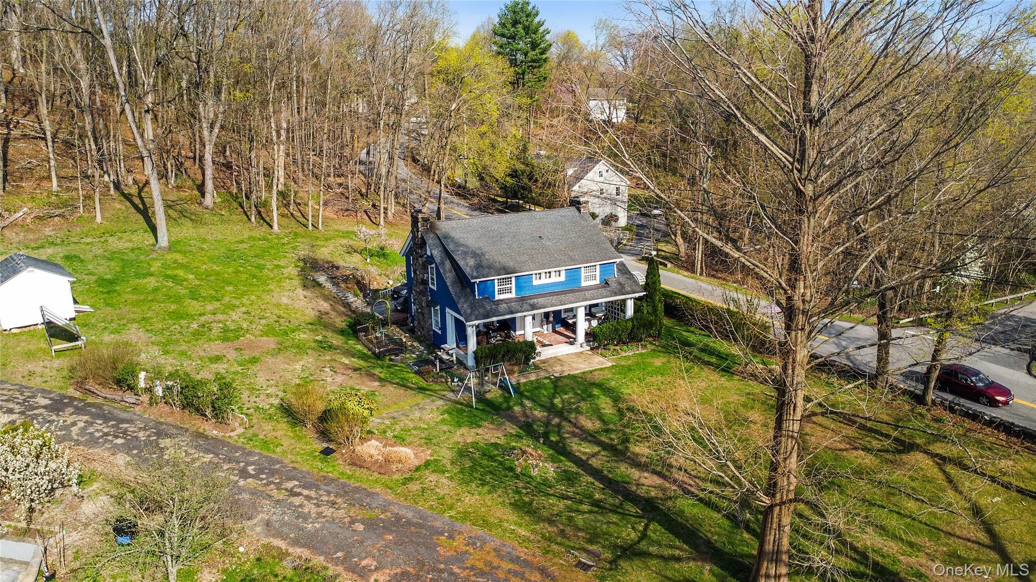 75 Chappaqua Road Briarcliff Manor, NY 10510 - Photo 42 of 50 Blue exterior residence with a covered front porch and dormer window