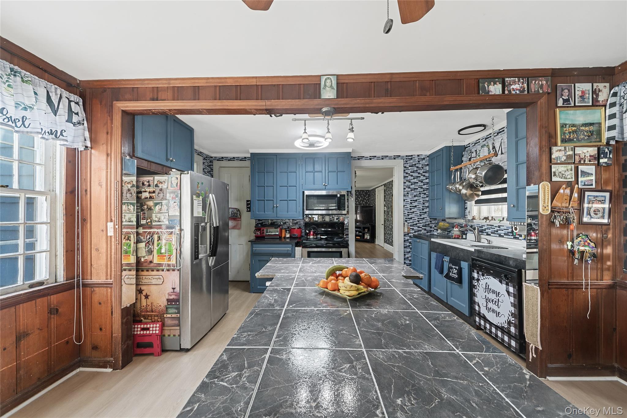 75 Chappaqua Road Briarcliff Manor, NY 10510 - Photo 7 of 50 Kitchen featuring blue cabinetry, a tiled backsplash, and a large island with a tiled countertop