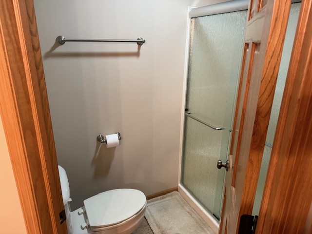 12027 Lisbon Road Newark, IL 60541 - Photo 16 of 29 a white toilet sitting next to a sink