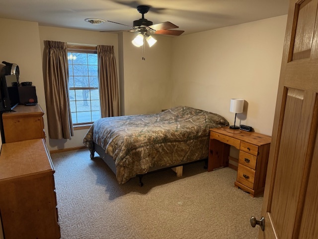 12027 Lisbon Road Newark, IL 60541 - Photo 17 of 29 a bedroom with a bed and a walk in closet