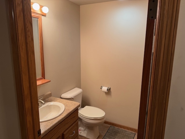 12027 Lisbon Road Newark, IL 60541 - Photo 20 of 29 a white toilet sitting next to a bathroom sink