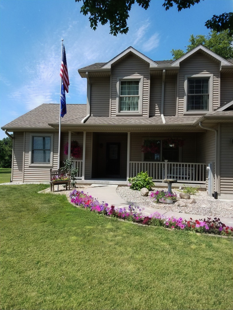 12027 Lisbon Road Newark, IL 60541 - Photo 2 of 29 a front view of house with yard