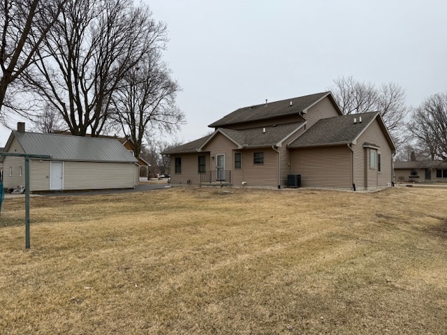 12027 Lisbon Road Newark, IL 60541 - Photo 5 of 29 a front view of a house with a yard and garage
