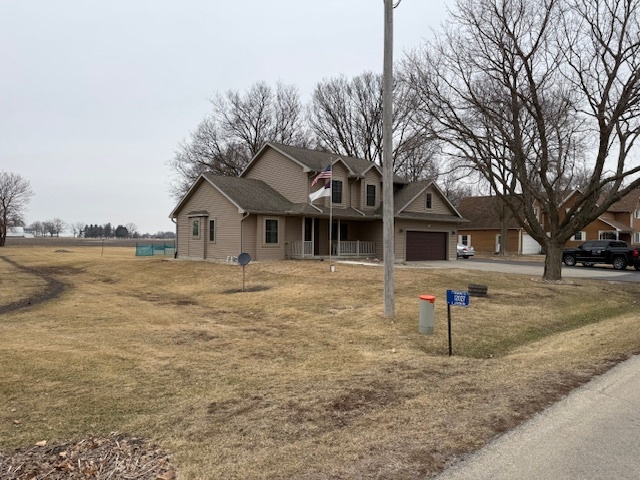 12027 Lisbon Road Newark, IL 60541 - Photo 6 of 29 a front view of a house with a yard