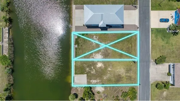 an aerial view of a house with a lake view