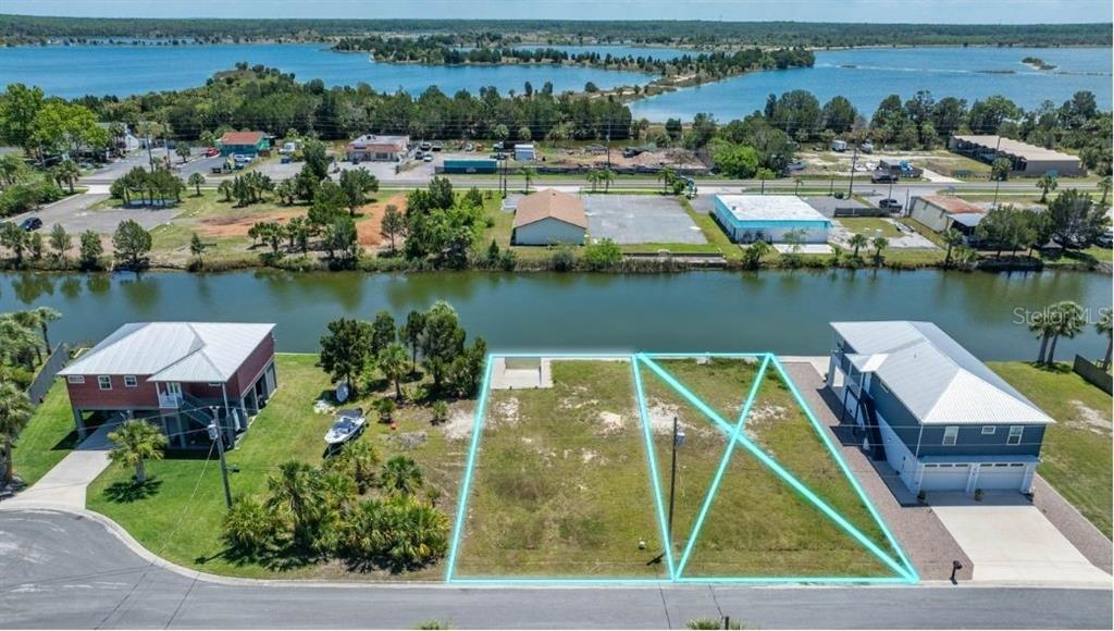3404 Fernleaf Drive Hernando Beach, FL 34607 - Photo 5 of 11 an aerial view of a house with a lake view
