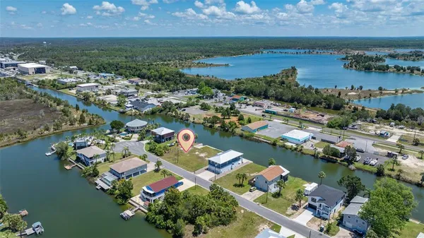 an aerial view of a houses and an outdoor space